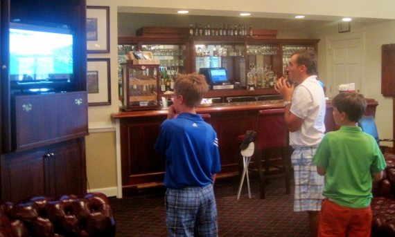 Andres Schonbaum, an Argentinian golfer, watches his native country compete in the World Cup on a television at the Pinehurst No. 8 clubhouse during the 114th North & South Amateur.
