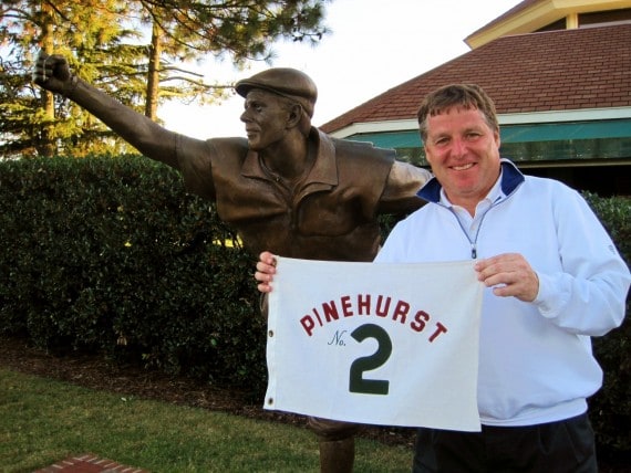 Don Potter stands with the flag from the 18th green on Pinehurst No. 2 after making eagle.